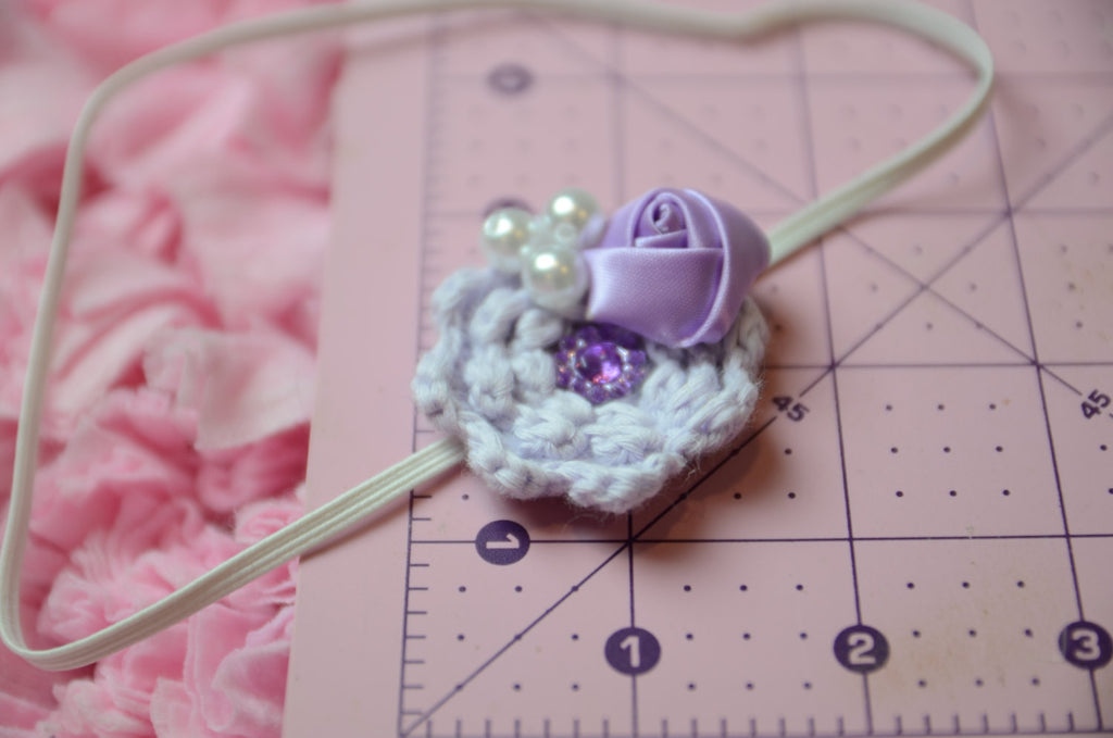 Knitted flower with rhinestone embellishments Purple & Lilac on white thin elastic band perfect for newborns - Pretty's Bowtique