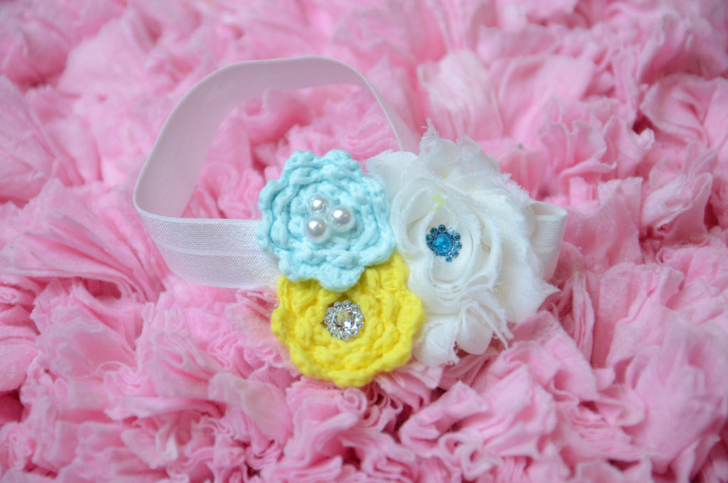 Shabby Rose flower with knitted flowers with rhinestone embellishments blue & yellow on white elastic band. - Pretty's Bowtique