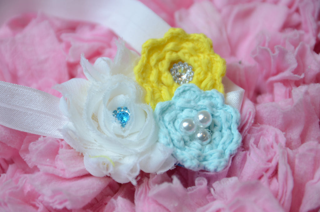 Shabby Rose flower with knitted flowers with rhinestone embellishments blue & yellow on white elastic band. - Pretty's Bowtique