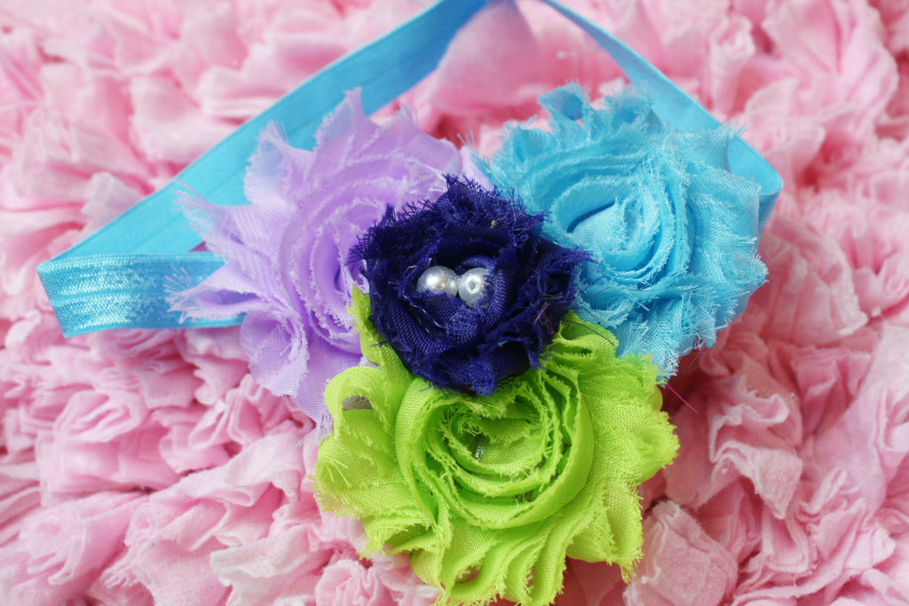 Shabby Rose flower headband with purple, lilac, blue,and green on turquoise headband with pearls - Pretty's Bowtique