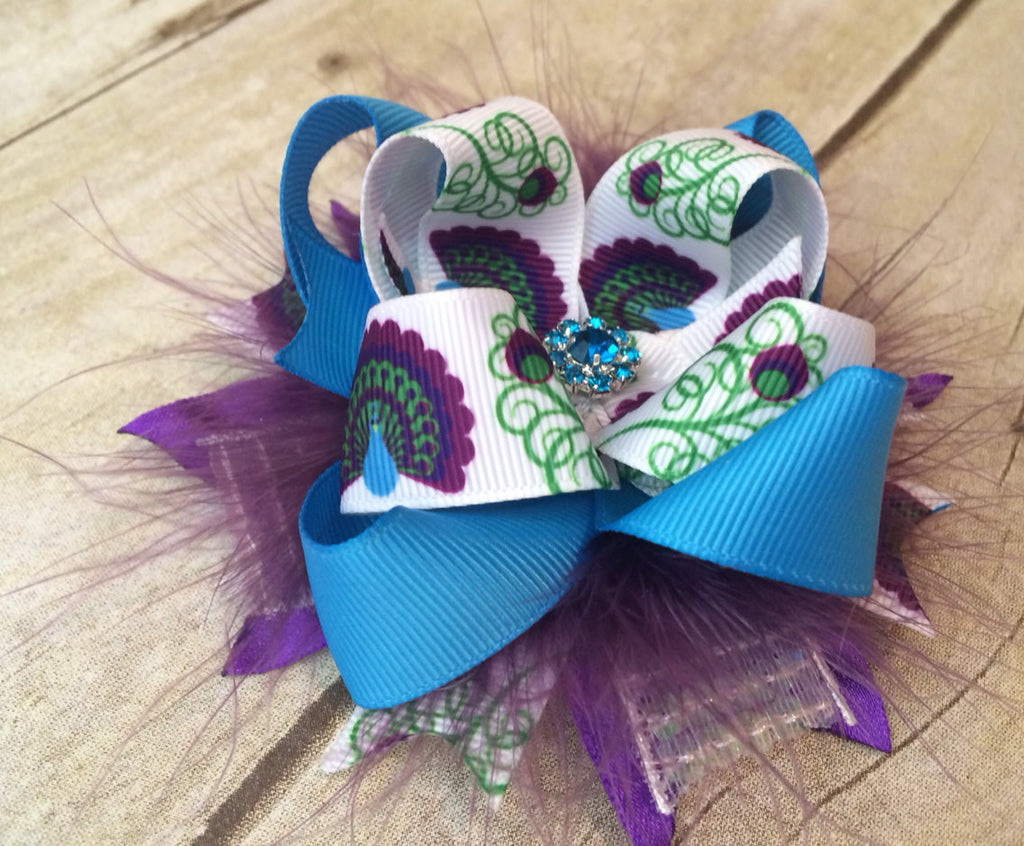 Over the top Peacock feathers, layered ribbon on a clip or headband. - Pretty's Bowtique