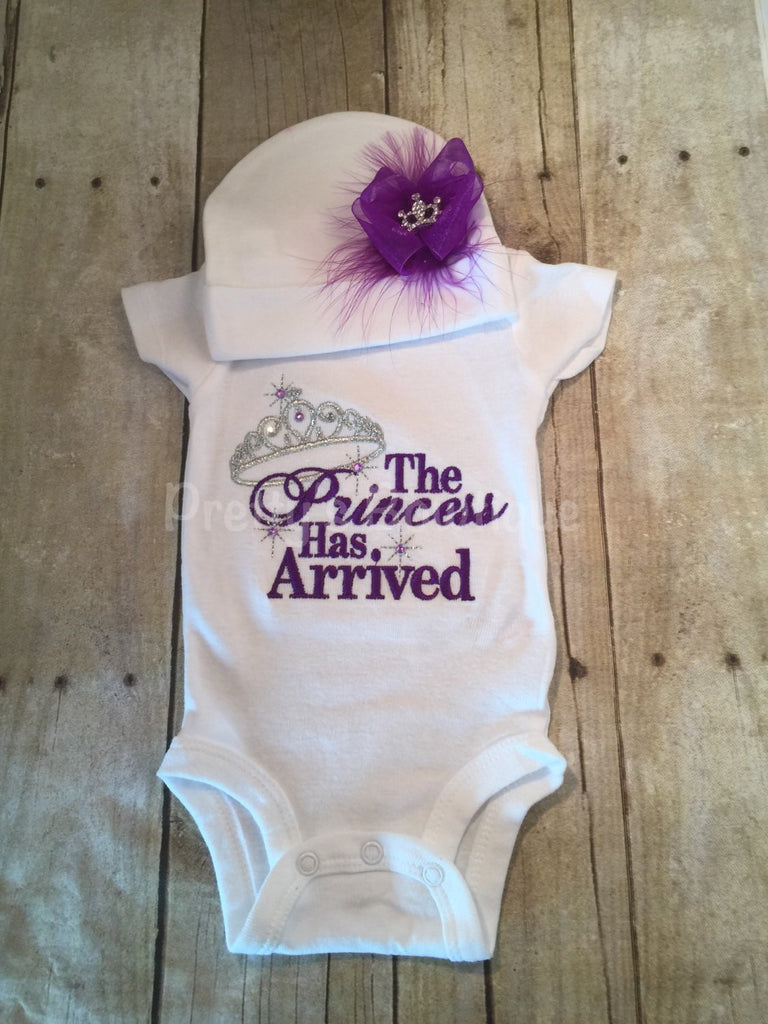 The Princess has arrived shirt purple bodysuit and hat set.  Perfect for hospital or coming home outfit - Pretty's Bowtique