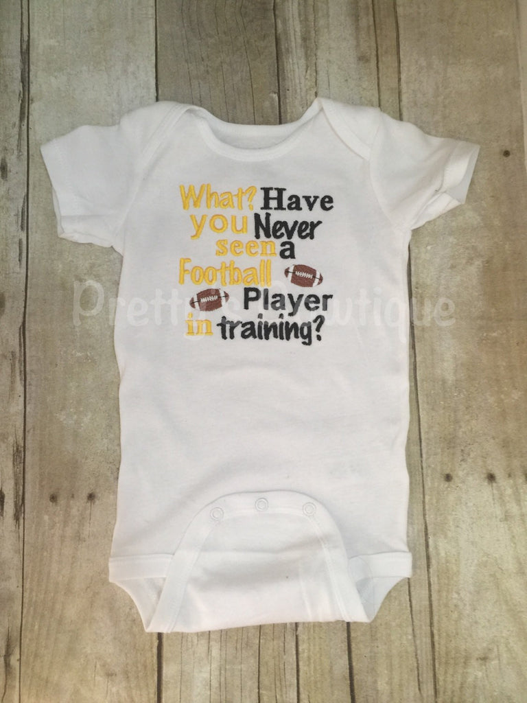What have you never seen a football player in training Football shirt for babies, toddler, and children.  You pick team colors - Pretty's Bowtique