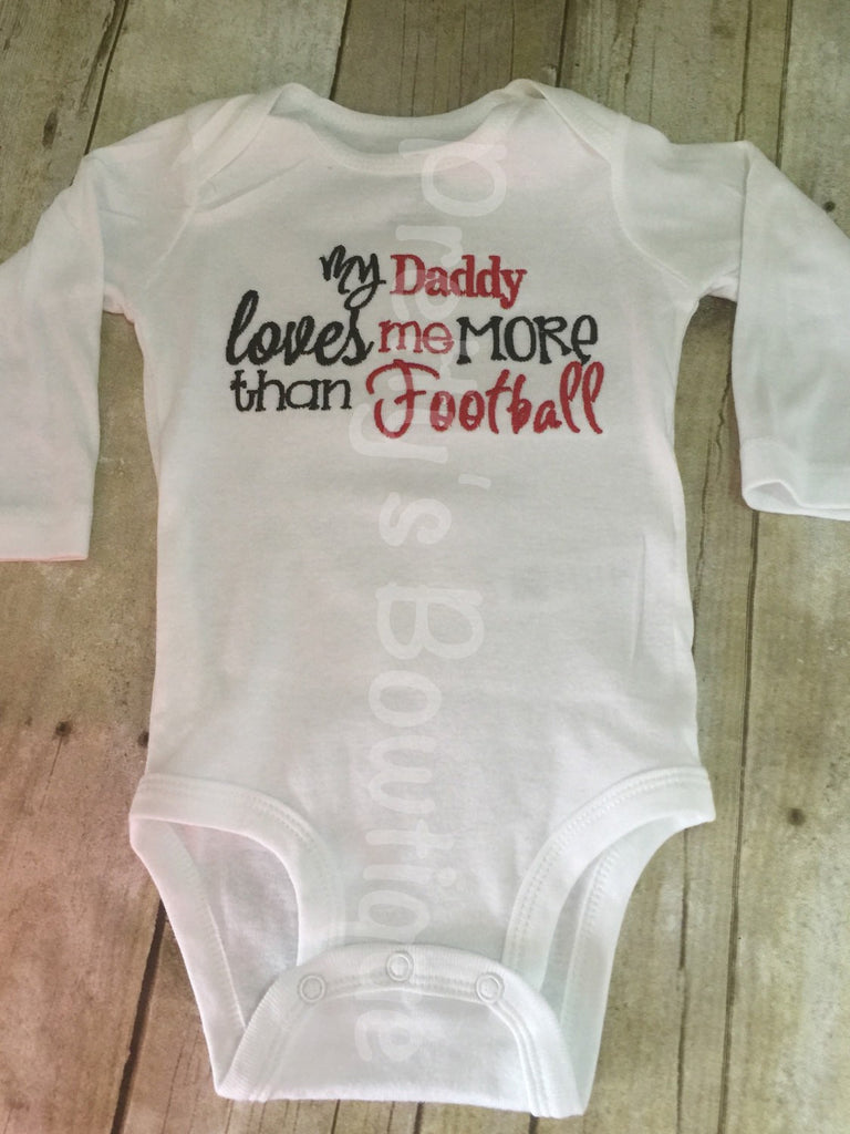 My Daddy loves me more than football bodysuit or shirt.  Can customize colors - Pretty's Bowtique